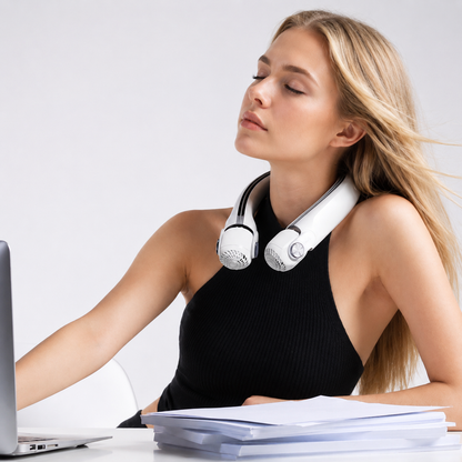 Blonde woman wearing a white directional rotor neck fan, eyes closed, enjoying the cooling breeze.