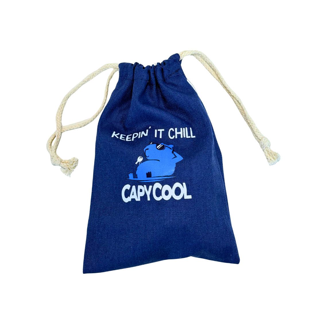 Navy blue Capycool Chill Bag drawstring pouch with "KEEP IT CHILL" and a capybara wearing sunglasses.