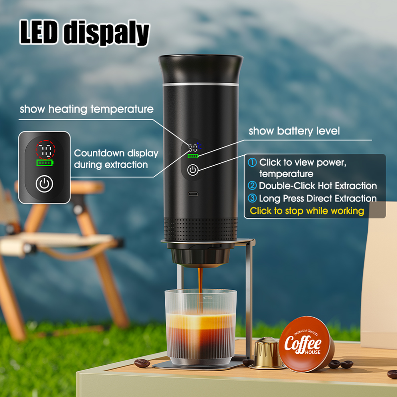 Black CapyPress 3-in-1 portable coffee machine brewing espresso into a glass, showing LED display and controls.