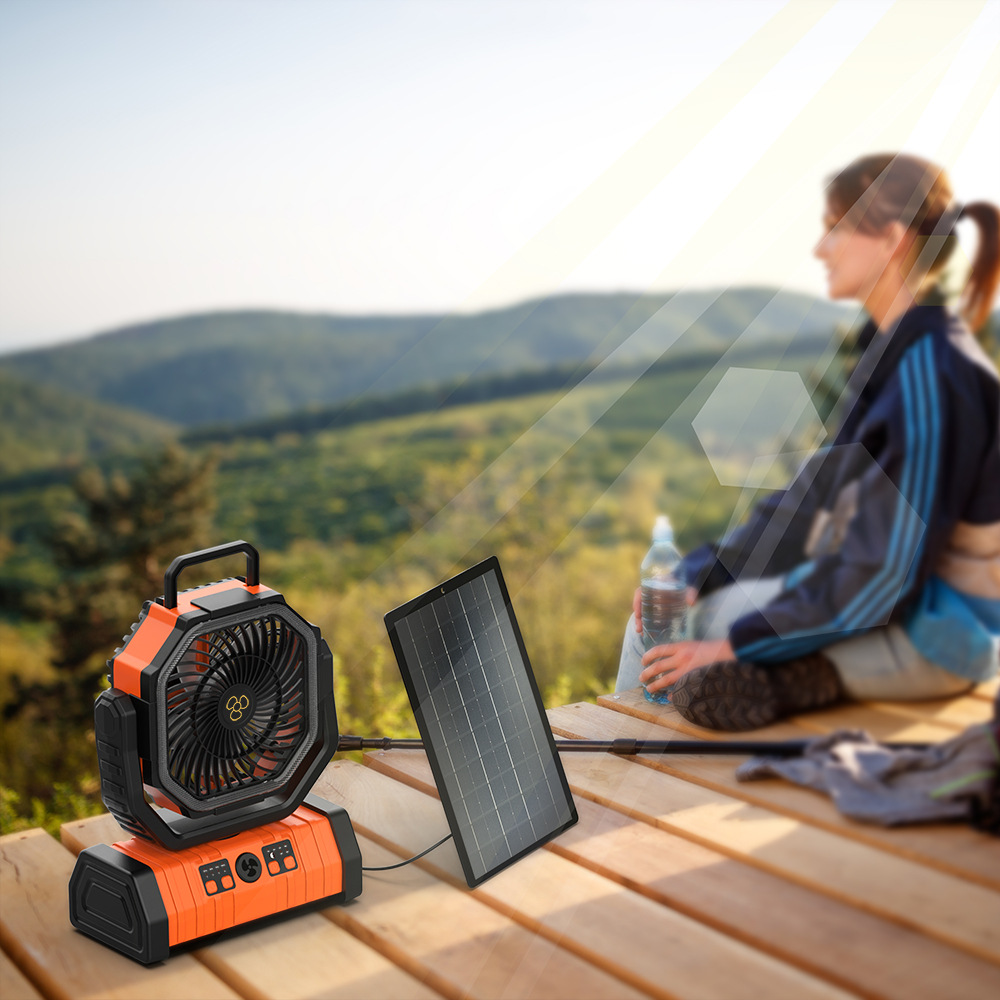 Portable camping fan with solar panel outdoors
