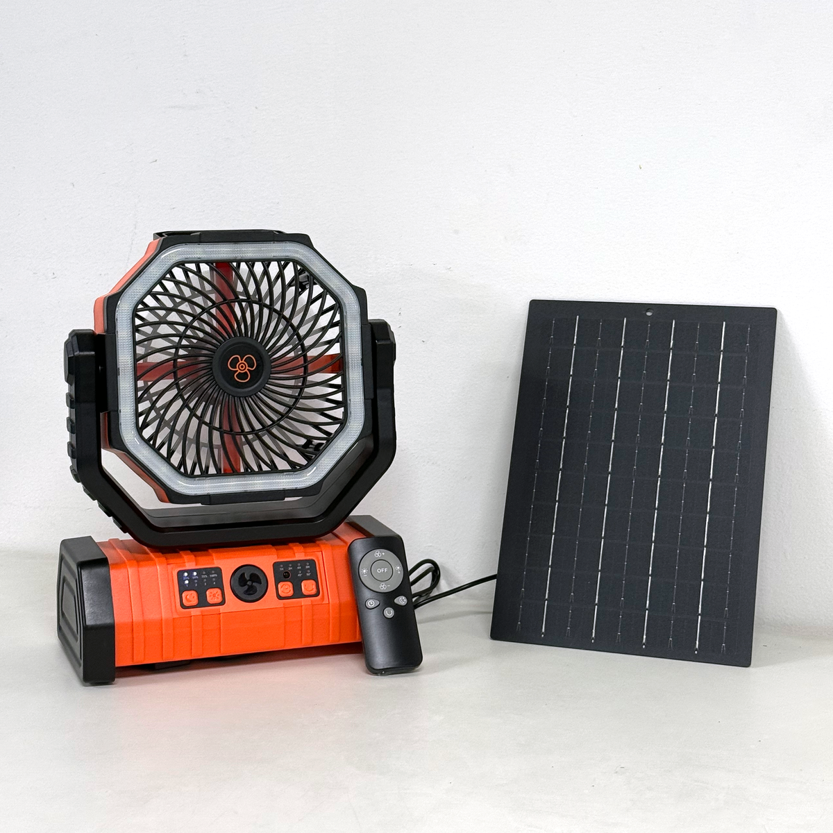 Orange portable camping fan with remote and solar panel