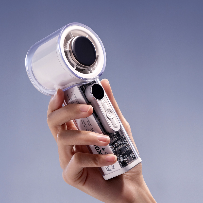 Hand holding a transparent mecha cooling fan with an ice compress plate and visible internal components.
