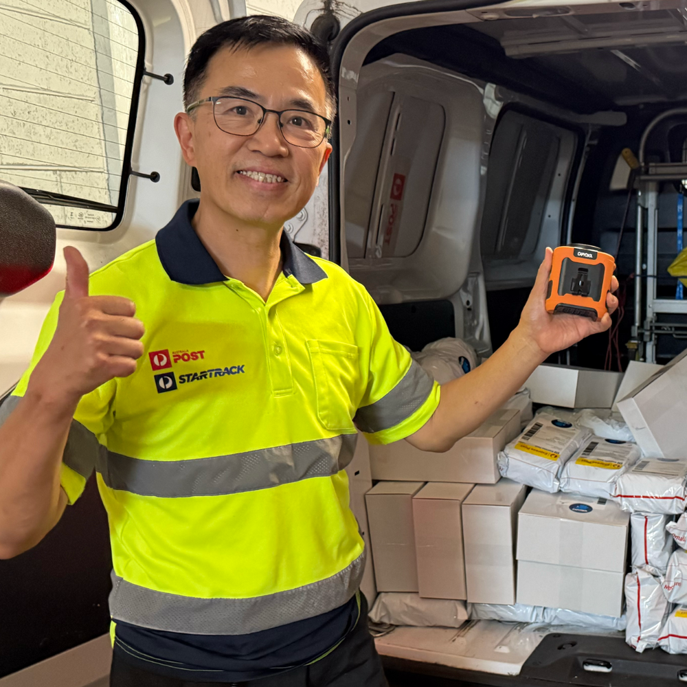 Australia Post courier holding a CapyCool portable fan